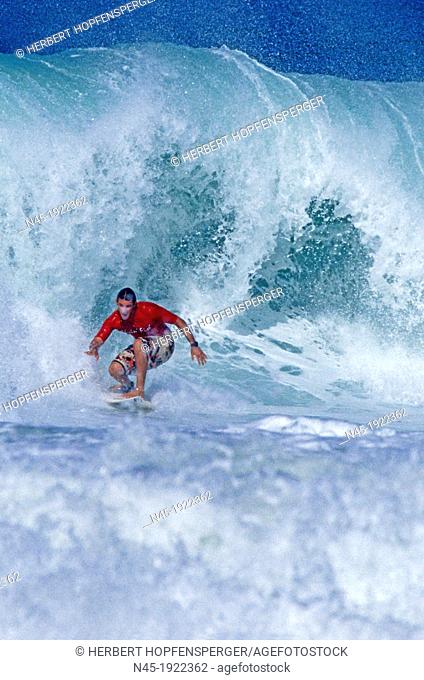 Barbados; Surfer is Riding a Wave; Caribbean Sea