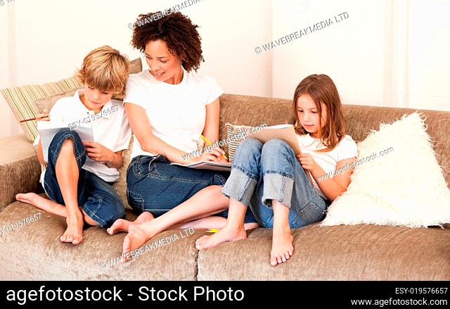 Charming family sitting on a sofa