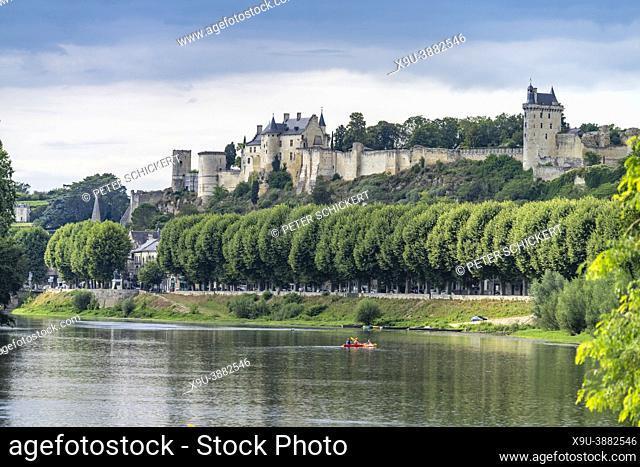 Kayaks on Vienne river approaching Chinon with the castle, Loire Valley, France