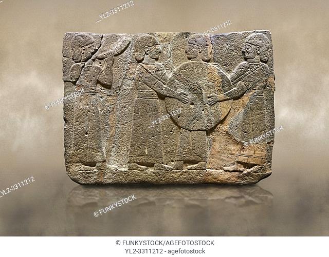 Photo of Hittite monumental relief sculpted orthostat stone panel of Procession. Basalt, KarkamÄ±s, (KargamÄ±s), Carchemish (Karkemish), 900 - 700 B