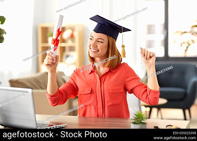 student woman with laptop and diploma at home