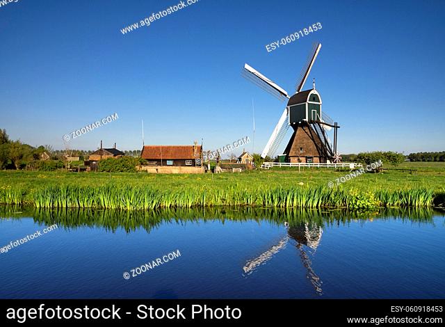 Windmill the Wingerdse Molen close to the Dutch village Bleskensgraaf seen on a clear and crisp day in spring