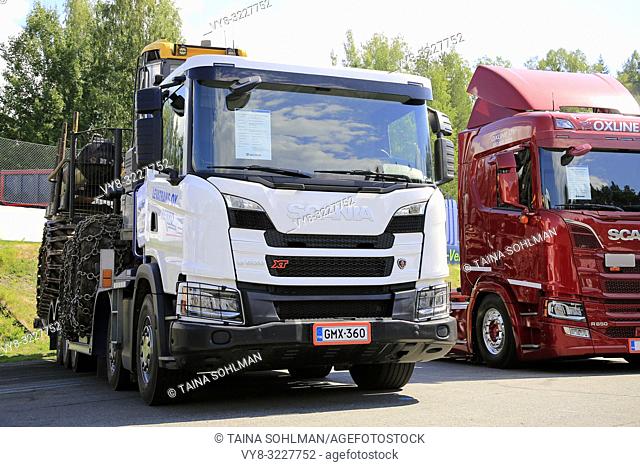 Hameenlinna, Finland - July 14, 2018: Next Generation Scania G500 XT forestry machinery transporter and R650 displayed on Tawastia Truck Weekend 2018