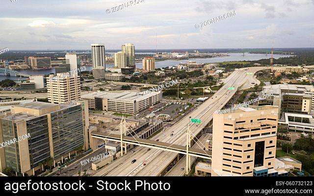 Light traffic exists before sunset in Jacksonville, Florida in this aerial view with St Johns River