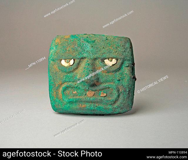 Face Mask Ornament. Date: 390-450; Geography: Peru; Culture: Moche (Loma Negra); Medium: Gilded copper, shell; Dimensions: H. 3 1/8 x W. 3 9/16 in. (7
