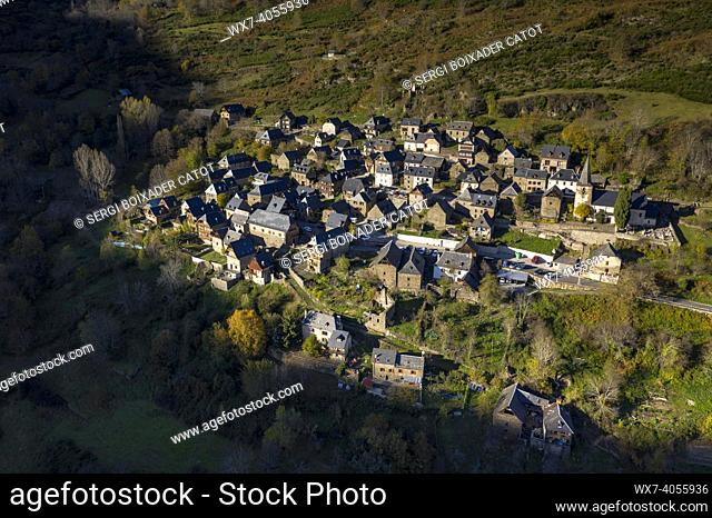 Aerial views of Bausen village and the surrounding forests in autumn (Aran Valley, Catalonia, Spain, Pyrenees)