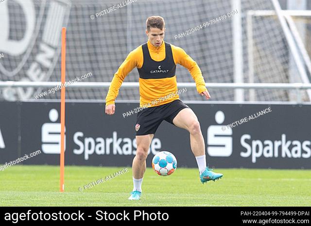 04 April 2022, Saxony, Dresden: Kyrylo Melichenko, a training guest from Ukraine, plays the ball during a Dynamo Dresden training session at the AOK PLUS Walter...