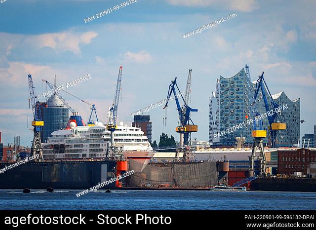 01 September 2022, Hamburg: The cruise ship MS Europa of Hapag-Lloyd Cruises is in dry dock at the Blohm+Voss shipyard. The striking silhouette of the Elbe...