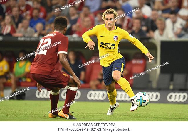 Madrid's Antoine Griezmann (R) takes on Liverpool's Joe Gomez during the Audi Cup final soccer match between Atletico Madrid and FC Liverpool in the Allianz...