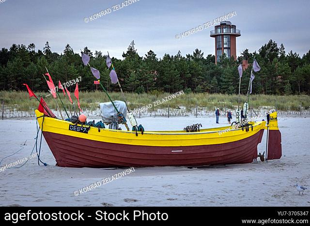 Fish boat on a beach and lookout tower in Debki village in administrative district of Gmina Krokowa, within Puck County, Pomeranian Voivodeship, northern Poland