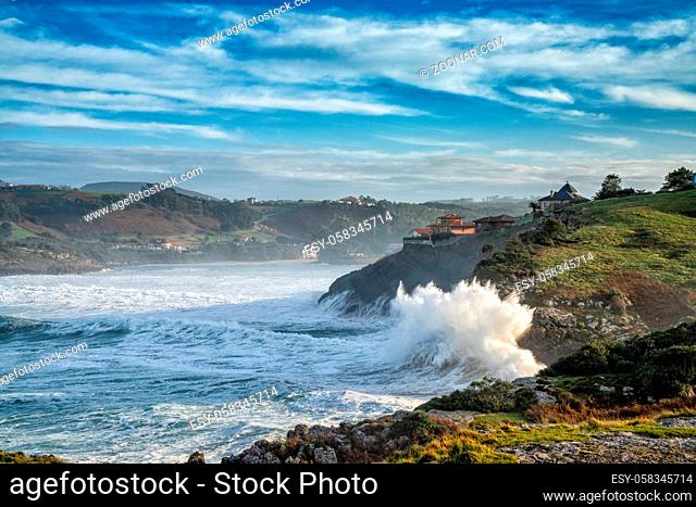 A view of huge waves crashing onto the shores of Cabo de Ajo on the northern Spanish coast