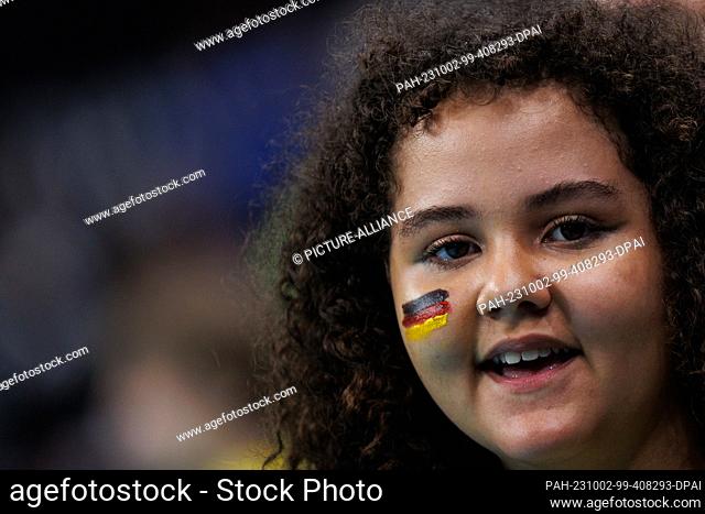 01 October 2023, Brazil, Rio de Janeiro: Volleyball, Men: Olympic Qualification, Group A, Cuba - Germany. A young fan follows the match