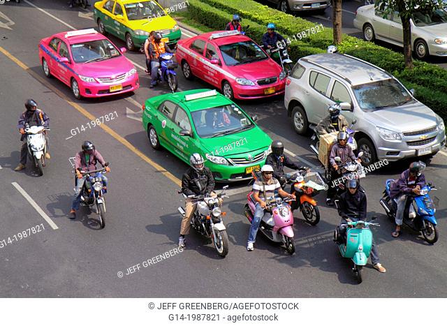 Thailand, Bangkok, Pathum Wan, Phaya Thai Road, traffic, taxi, taxis, cabs, motorcycles, motor scooters, Skywalk, view, overhead, aerial, Asian, man