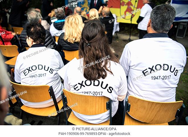 06 September 2019, Lower Saxony, Wilhelmshaven: Three participants, wearing T-shirts with the imprint ""Exodus 1947 - 2017"" on their backs