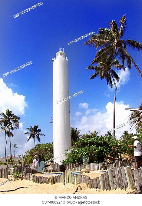 a white lighthouse at bahia beach sands