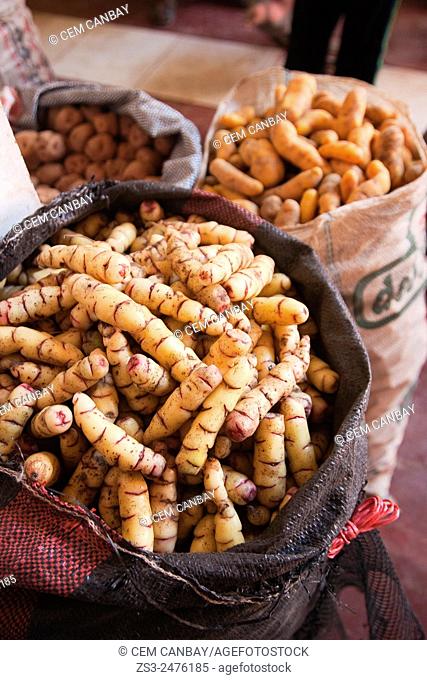 Different kinf od native; potatoes in sacks at the market place, Pisaq, Sacred Valley, Peru, South America