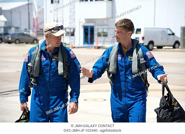 At Ellington Airport in Houston, NASA astronauts Steve Swanson (left), Expedition 40 commander, and Reid Wiseman Expedition 40 flight engineer