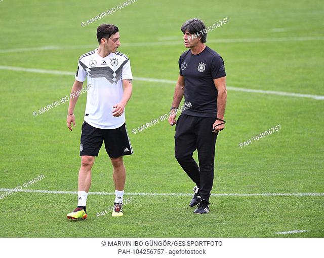Bundescoach Joachim Jogi Loew (Germany) speaks with Mesut Oezil (Germany). GES / Football / Preparing for the 2018 World Cup: Training of the German national...
