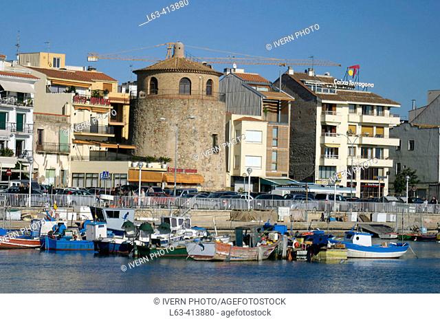 Fishing boats and tower by the port, Cambrils. Tarragona province, Catalonia. Spain