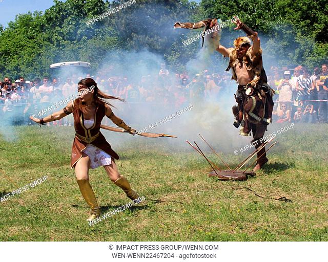 Performers take part in a battle reenactment of proto-Bulgarians against the Byzantium soldiers in the village of Arbanasy