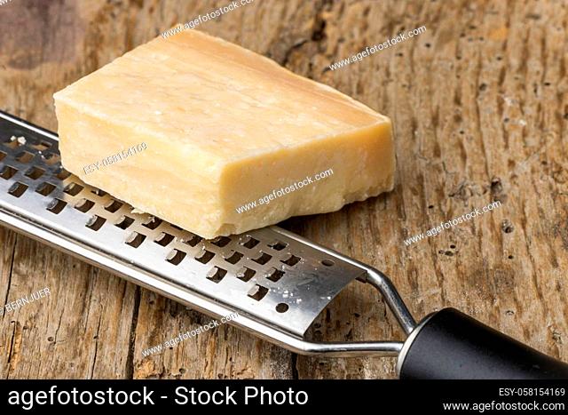 italian parmigiano cheese with grater