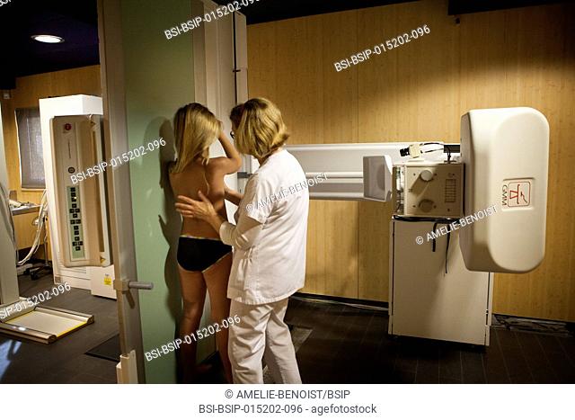 Reportage in a radiology centre in Haute-Savoie, France. A technician carries out an x-ray on a young girl suffering from scoliosis