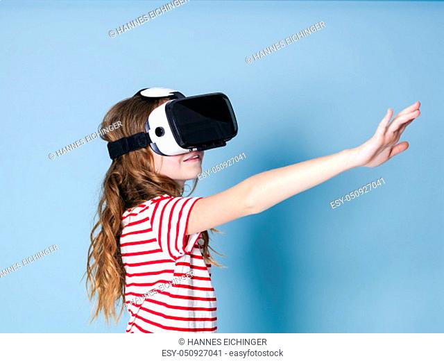 smiling positive girl wearing virtual reality glasses goggles headset, vr box. connection, modern, new generation, concept