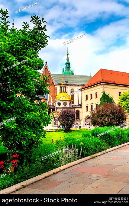 Krakow, Poland, Wawel Royal Castle colorful postcard view against flowers and green trees in the garden