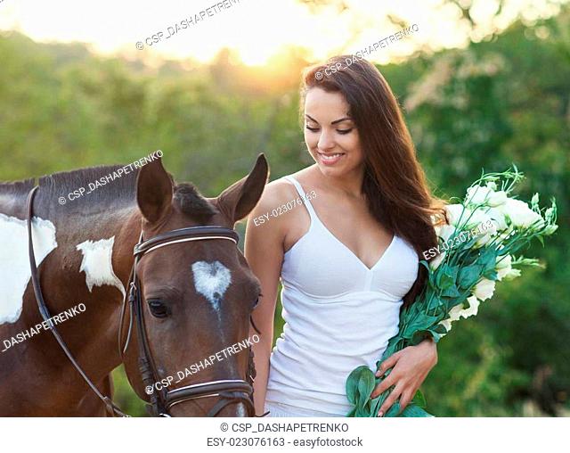 Beautiful woman and a horse