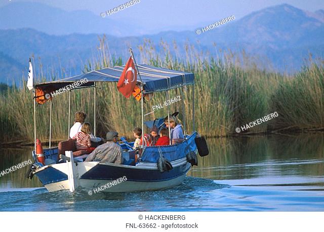 Group of people traveling on boat in river, Mugla, Turkey
