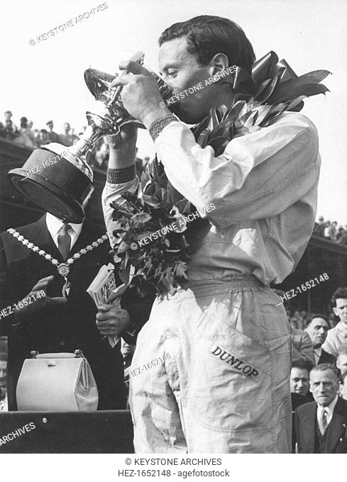 A trophy of champagne for driver Jim Clark, winner of the Aintree 200 race, April 1962. Scottish Formula One racing driver Jim Clark (1936-1968) was killed in a...