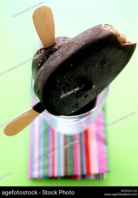 Chocolate-covered chocolate ice cream on stick