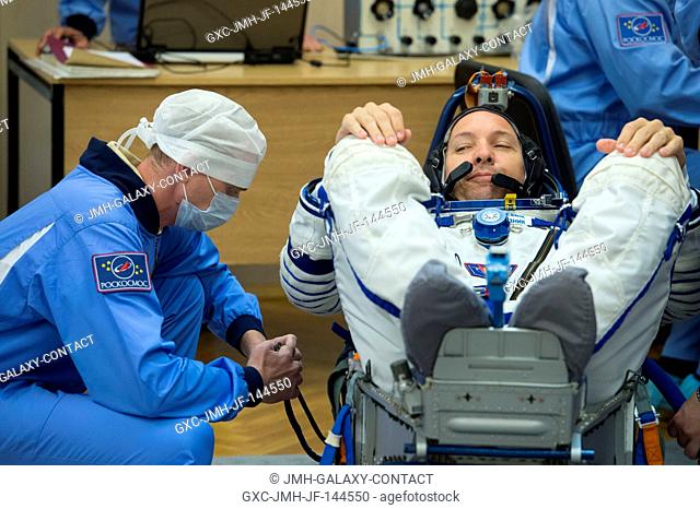 In the Integration Facility at the Baikonur Cosmodrome in Kazakhstan, Expedition 52-53 crewmember Randy Bresnik of NASA undergoes a leak check of his Russian...