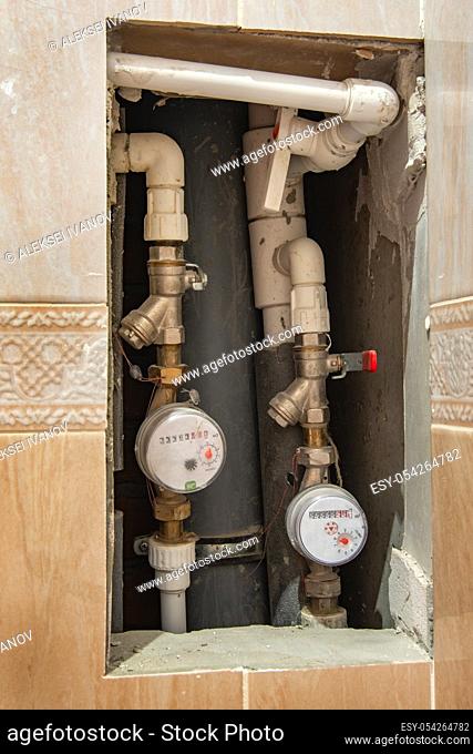 cold and hot water meters embedded in the wall