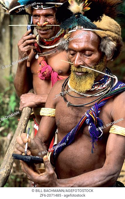 Colorful Huli Wigmen of Papua New Guinea with Palm Pilot and Cell Phone