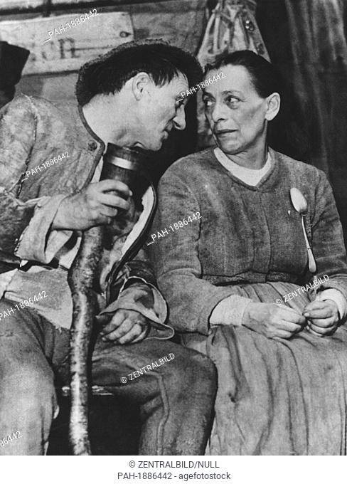 German singer and actor Ernst Busch (L) and German actress Helene Weigel (R) during a performance of Bertolt Brecht's 'Mother Courage and Her Children' at the...
