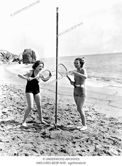 Los Angeles, California: c. 1933.Renee Whitney and Lorena Layson engage in a close game of tetherball on the beach