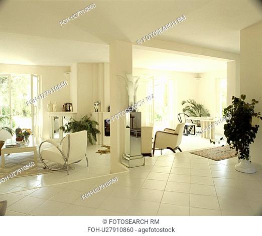 White floor tiles in modern openplan white living room