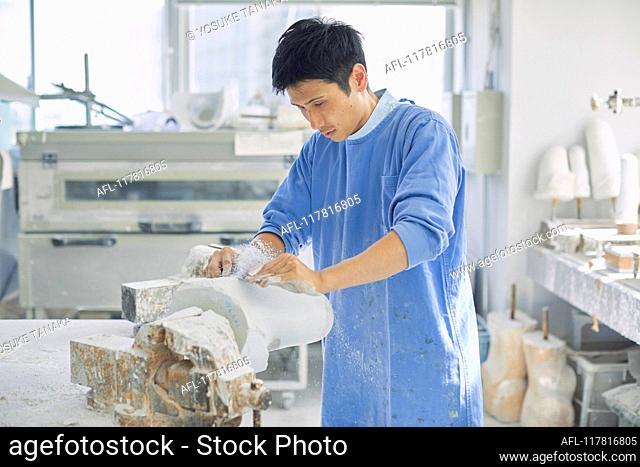 Japanese prosthetist working in his studio