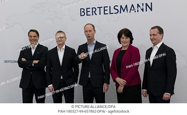 27 March 2018, Germany, Berlin: The Bertelsmann board poses for photographers prior to a press conference: Markus Dohle (l-r