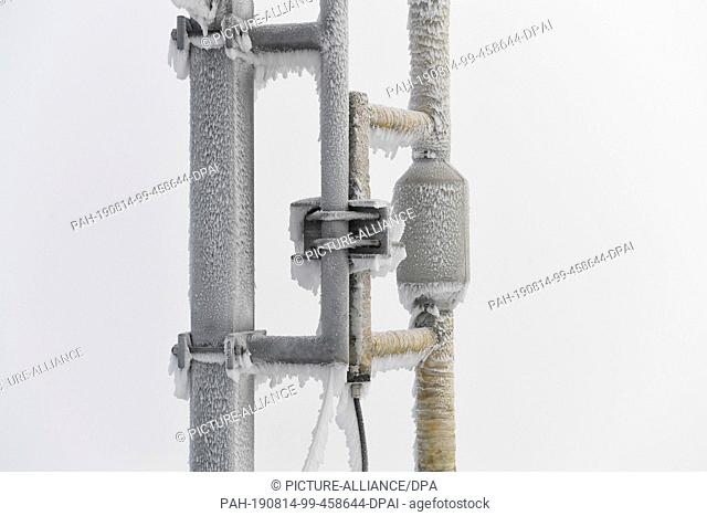 14 August 2019, Bavaria, Zugspitze: Iced technical equipment on the tower of the Zugspitze weather station. Photo: Felix Hörhager/dpa
