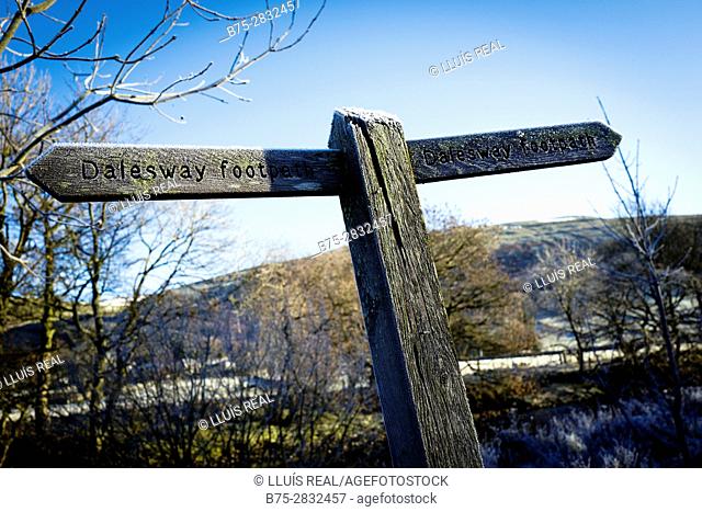 Wooden signpost of a trail (Dales Way footpath) on a cold morning with frost.. Buckden, Skipton, North Yorkshire, England, UK