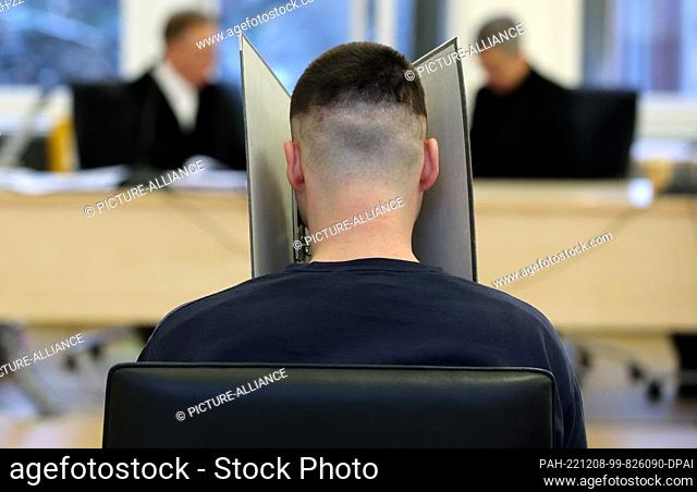 08 December 2022, Mecklenburg-Western Pomerania, Rostock: The defendant in the triple murder trial waits in the courtroom for the trial to continue