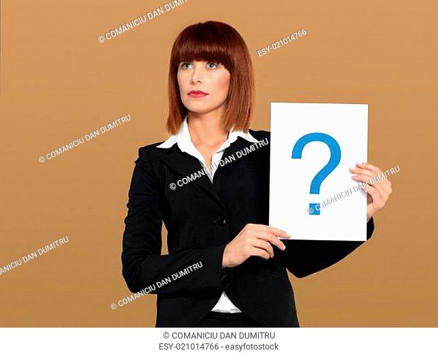 pretty, young businesswoman holding question mark sign