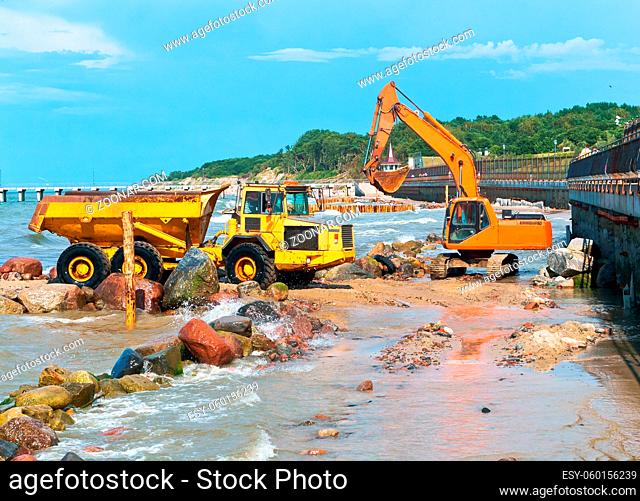 construction equipment on the shore, the construction of breakwaters, coastal protection measures