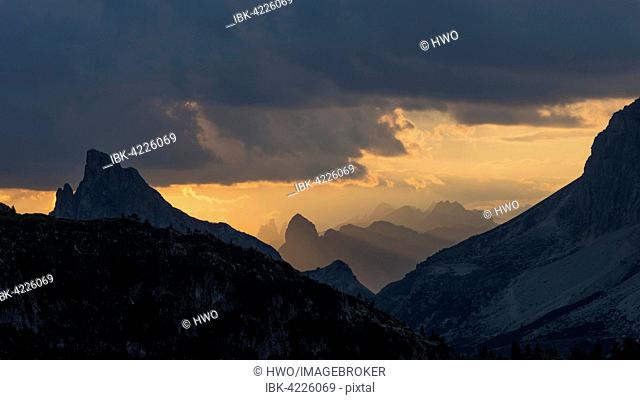 Sunset at Valparola Pass, Hexenberg with summit cross, little Lagazuoi on the right, Dolomites, Alps, Veneto, Italy