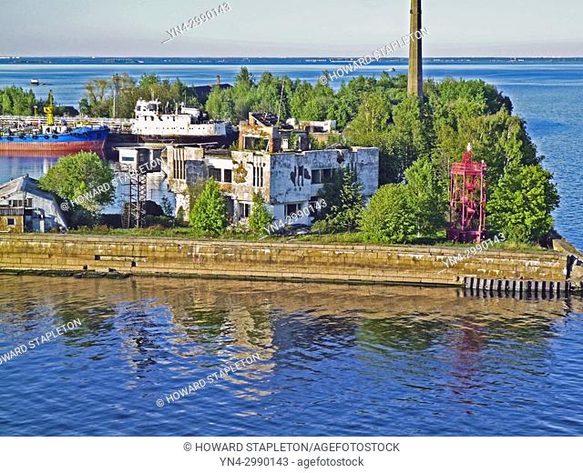 Kotlin Island 20 miles west of St. Petersburg, Russia. A Kronshtadt harbor lighthouse and Russian Naval vessels are shown here