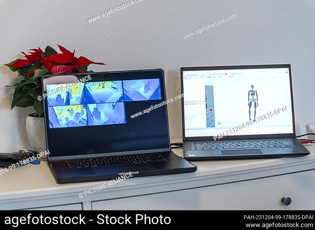 04 December 2023, Bavaria, Kulmbach: Monitors show the movements of people in the rooms of the Live-In-Lab. A research environment has been created in two...