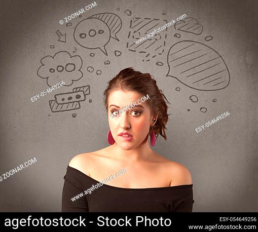 A cute female student making funny expressions with thoughts in her head illustrated by drawn chat bubbles on the urban wall background concept