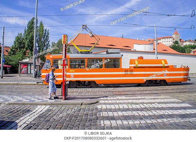 A special tram used for lubricating tracks, equipped with a water tank, rides through the Klarov in Prague, Czech Republic, on Sunday, July 30, 2017